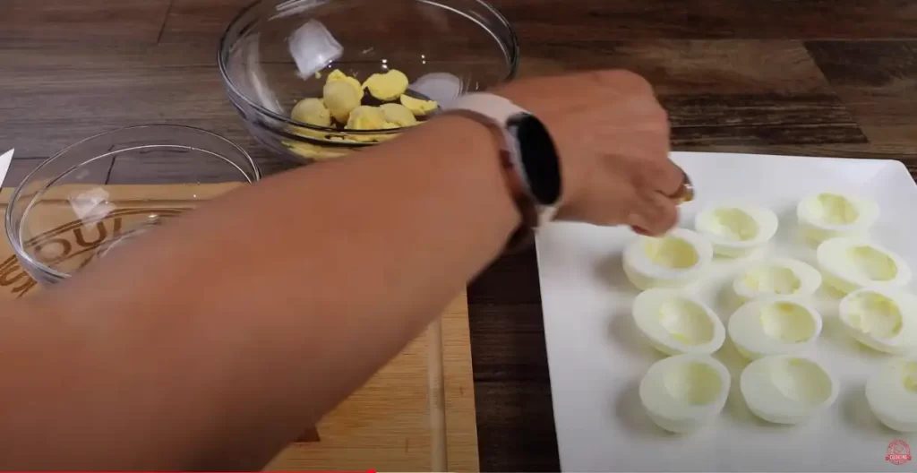 separating the egg yolk from the white